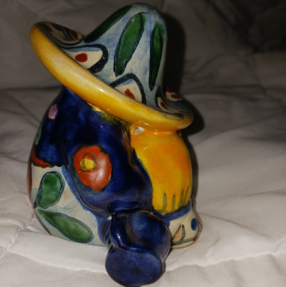 Unique figure sitting with a Sombrero on